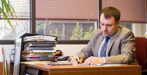 Rob DelCampo of Innovation Academy at desk