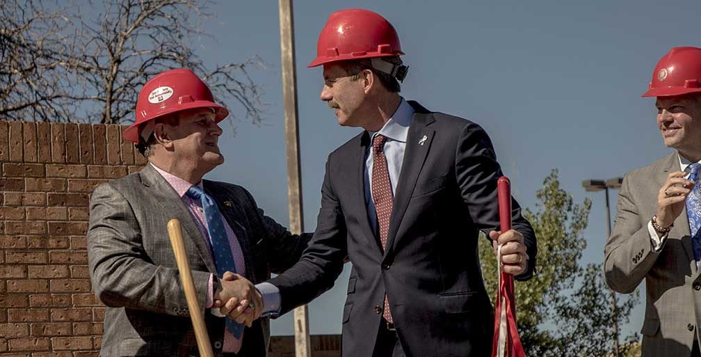 Mayor Berry shakes hands with developer